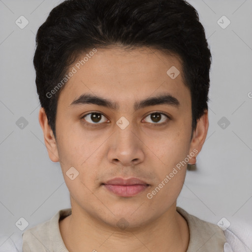 Joyful latino young-adult male with short  brown hair and brown eyes