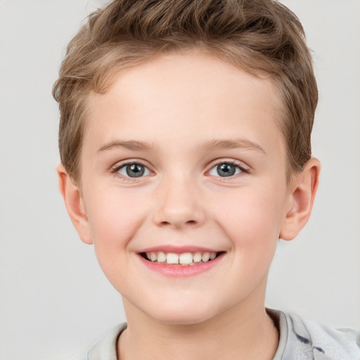 Joyful white child female with short  brown hair and grey eyes