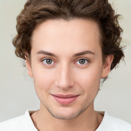 Joyful white young-adult female with short  brown hair and green eyes