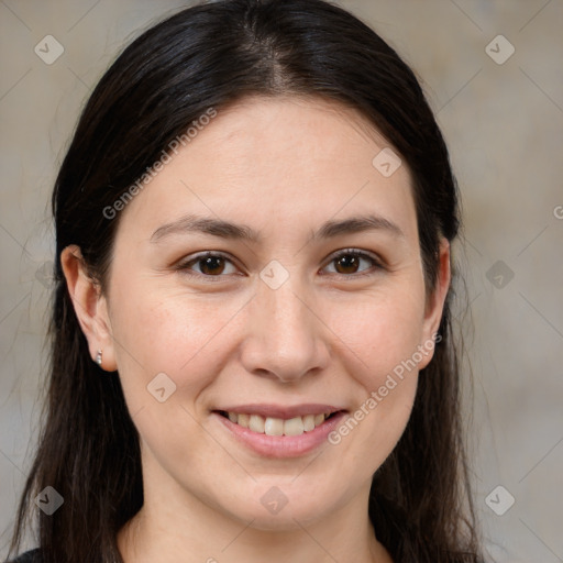 Joyful white young-adult female with long  brown hair and brown eyes