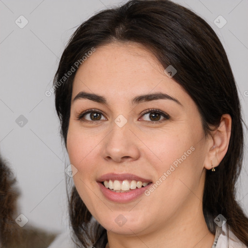 Joyful white young-adult female with medium  brown hair and brown eyes