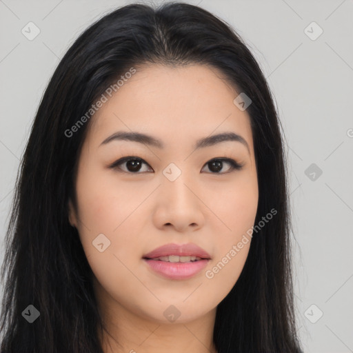 Joyful asian young-adult female with long  black hair and brown eyes