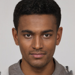 Neutral black young-adult male with short  brown hair and brown eyes