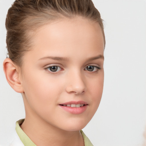 Joyful white child female with short  brown hair and brown eyes