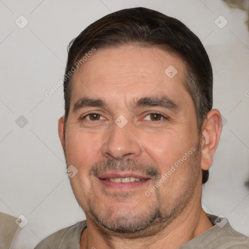 Joyful white adult male with short  brown hair and brown eyes