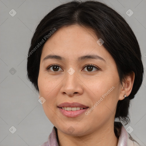 Joyful asian adult female with medium  brown hair and brown eyes