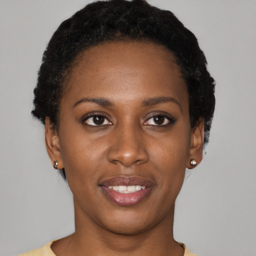 Joyful latino young-adult female with short  black hair and brown eyes