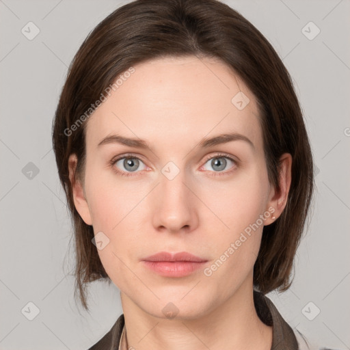 Neutral white young-adult female with medium  brown hair and grey eyes