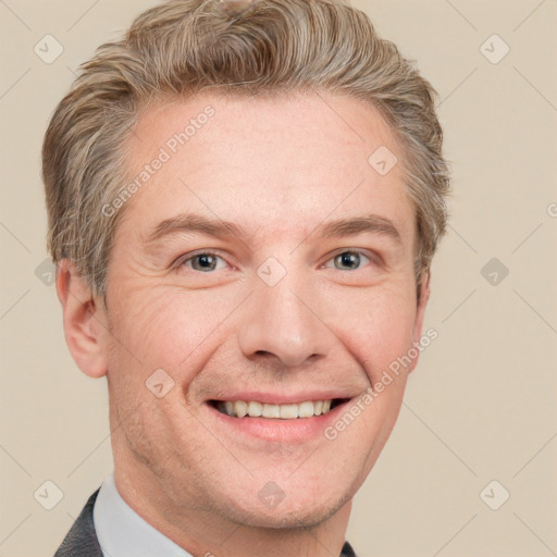 Joyful white adult male with short  brown hair and grey eyes