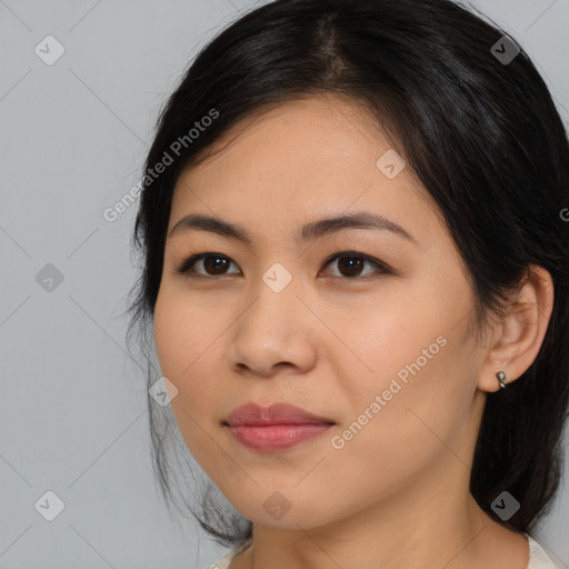 Joyful asian young-adult female with medium  brown hair and brown eyes