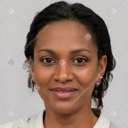 Joyful latino adult female with short  brown hair and brown eyes