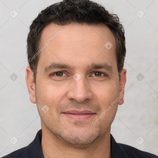 Joyful white adult male with short  brown hair and brown eyes