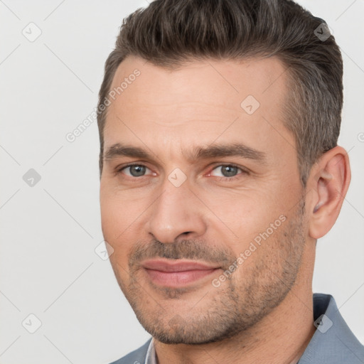 Joyful white adult male with short  brown hair and brown eyes