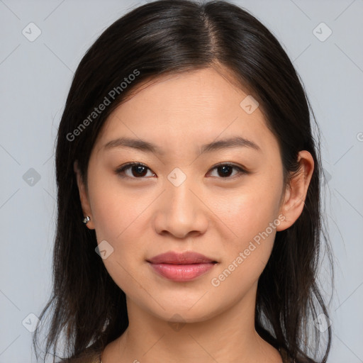 Joyful asian young-adult female with long  brown hair and brown eyes