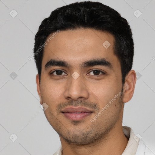 Joyful latino young-adult male with short  black hair and brown eyes