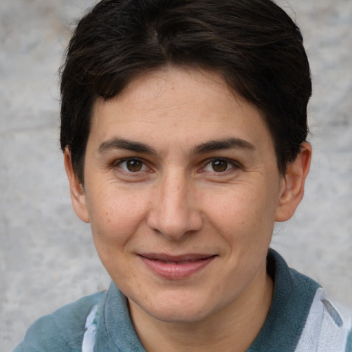 Joyful white adult female with short  brown hair and brown eyes