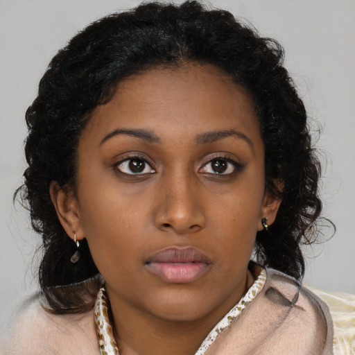 Neutral black young-adult female with long  brown hair and brown eyes