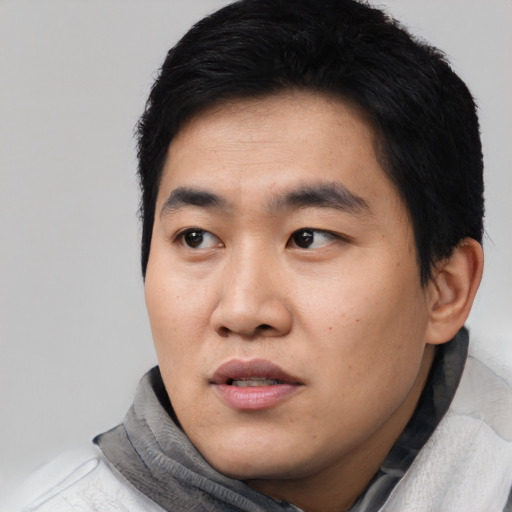 Neutral asian young-adult male with short  black hair and brown eyes