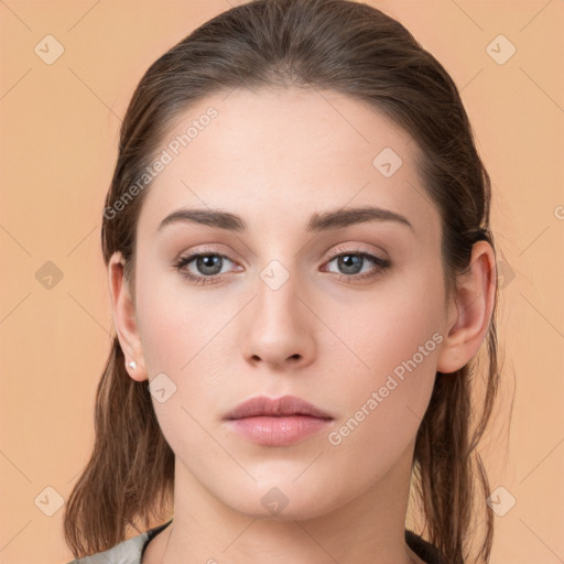 Neutral white young-adult female with long  brown hair and brown eyes