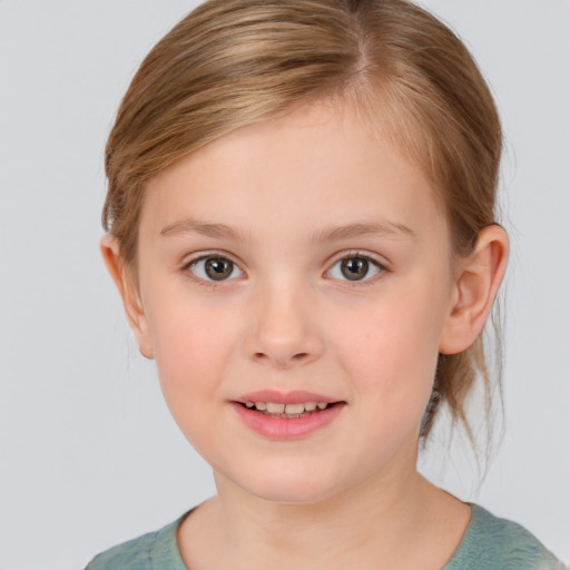 Joyful white child female with short  brown hair and brown eyes