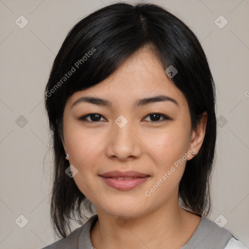 Joyful asian young-adult female with medium  black hair and brown eyes