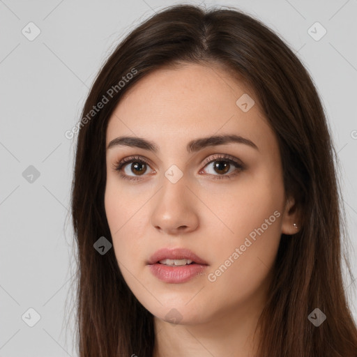 Neutral white young-adult female with long  brown hair and brown eyes