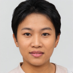 Joyful asian young-adult female with short  black hair and brown eyes