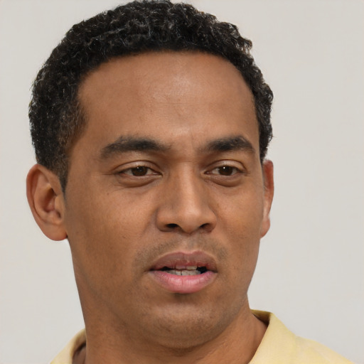 Neutral black young-adult male with short  black hair and brown eyes