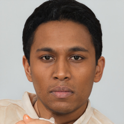 Neutral latino young-adult male with short  black hair and brown eyes