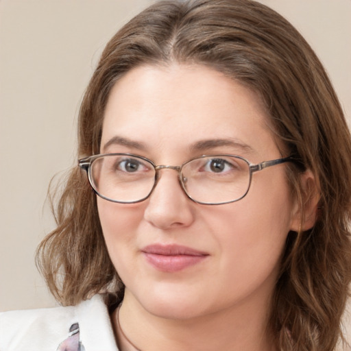 Joyful white young-adult female with medium  brown hair and green eyes