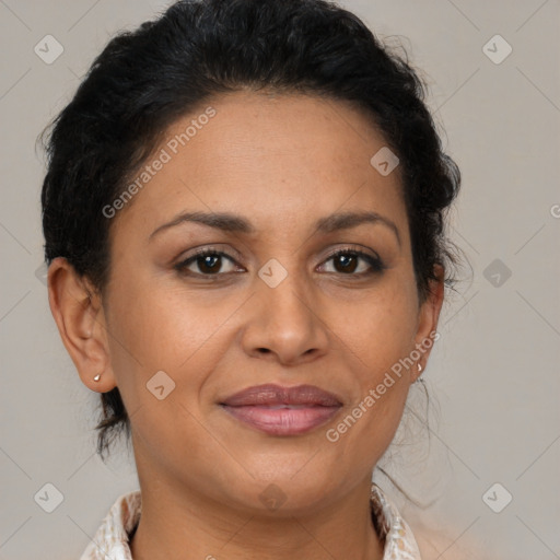 Joyful latino adult female with medium  brown hair and brown eyes