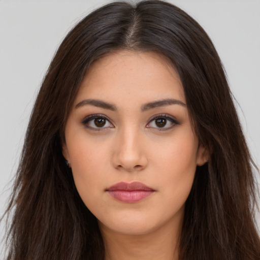 Neutral latino young-adult female with long  brown hair and brown eyes