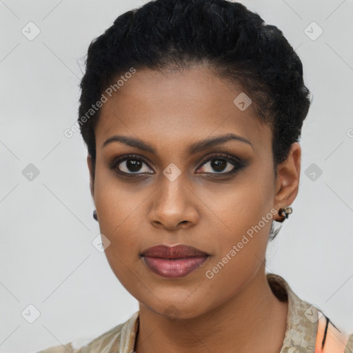 Joyful black young-adult female with short  brown hair and brown eyes