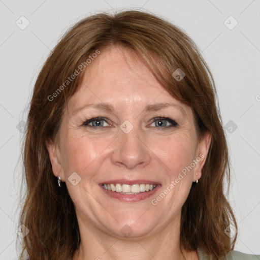 Joyful white adult female with medium  brown hair and grey eyes