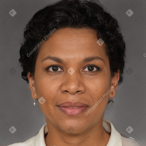 Joyful black adult female with short  brown hair and brown eyes