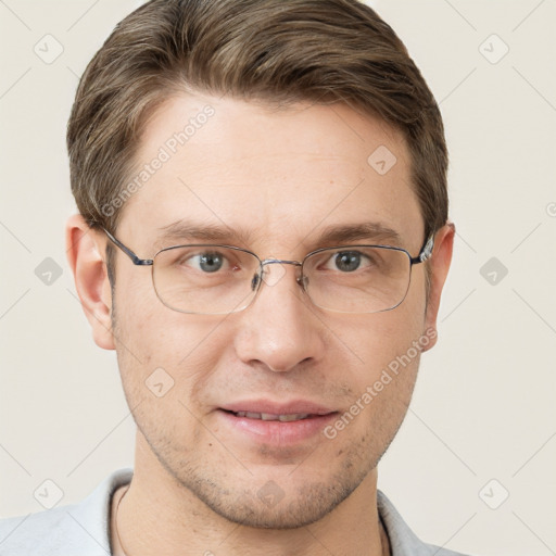 Joyful white adult male with short  brown hair and grey eyes