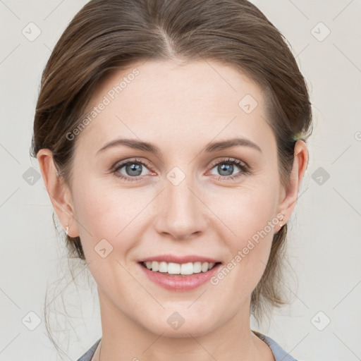 Joyful white young-adult female with medium  brown hair and blue eyes