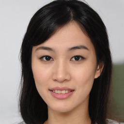 Joyful asian young-adult female with medium  black hair and brown eyes