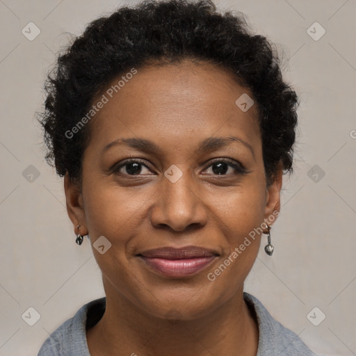 Joyful black adult female with short  brown hair and brown eyes