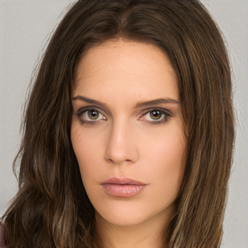 Neutral white young-adult female with long  brown hair and brown eyes