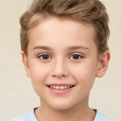 Joyful white child male with short  brown hair and brown eyes