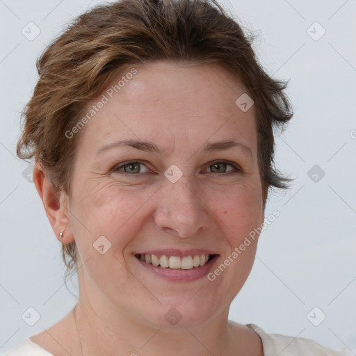 Joyful white adult female with short  brown hair and brown eyes