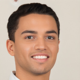 Joyful white young-adult male with short  black hair and brown eyes