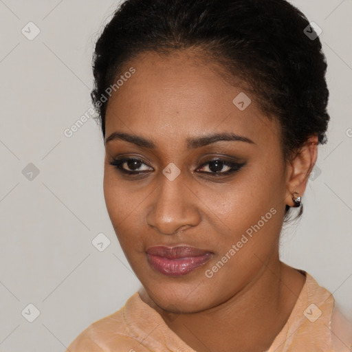 Joyful black young-adult female with short  brown hair and brown eyes