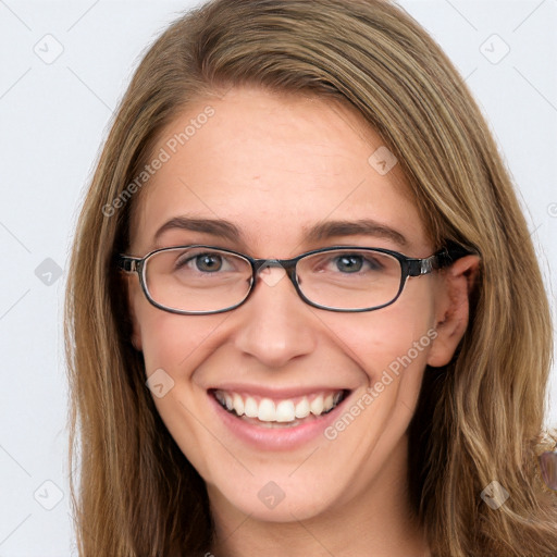 Joyful white young-adult female with long  brown hair and blue eyes