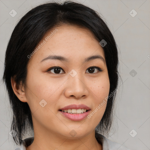 Joyful asian young-adult female with medium  brown hair and brown eyes