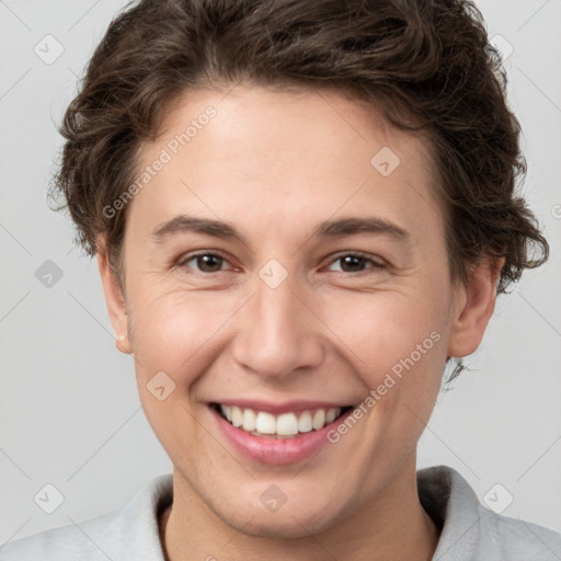 Joyful white young-adult female with short  brown hair and brown eyes