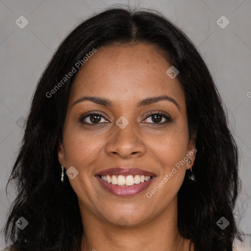 Joyful black young-adult female with long  brown hair and brown eyes