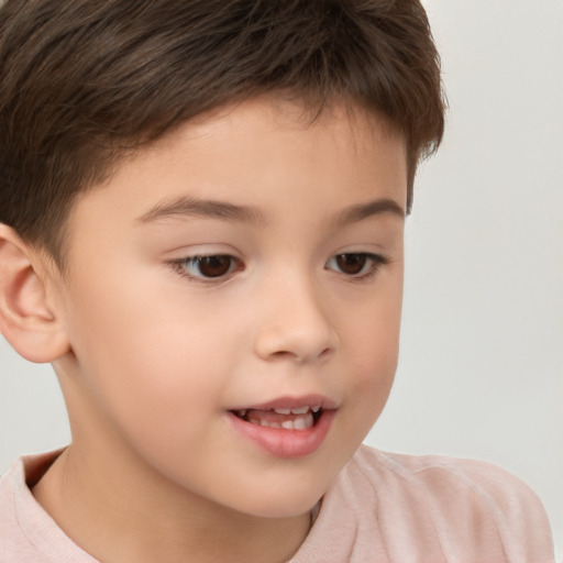 Joyful white child male with short  brown hair and brown eyes