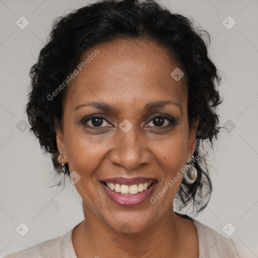 Joyful black adult female with short  brown hair and brown eyes